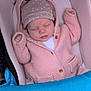 baby, blanket, blue_cover, child, cozy, cute, face, hands, hat, indoors, infant, knitted_hoodie, newborn, peaceful, pink_clothing, portrait, resting, sleeping, soft, stroller