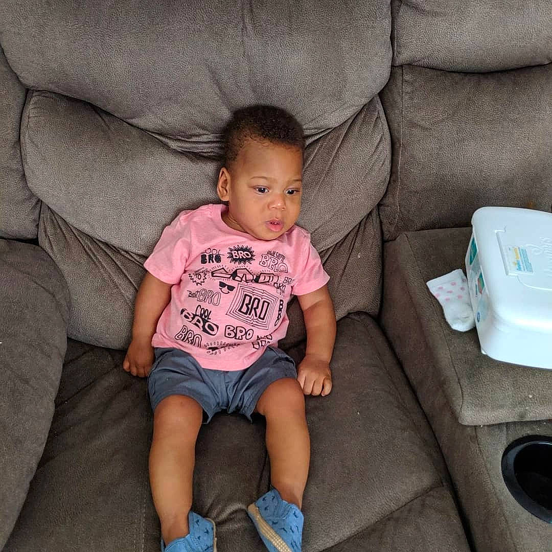 Cortez joined the competition — help win amazing prizes! baby, chair, cheek, child, daughter, electronic_device, finger, fun, furniture, leg, person, pink, shoe, sitting, skin, smile, t_shirt, technology, toddler, vacation
