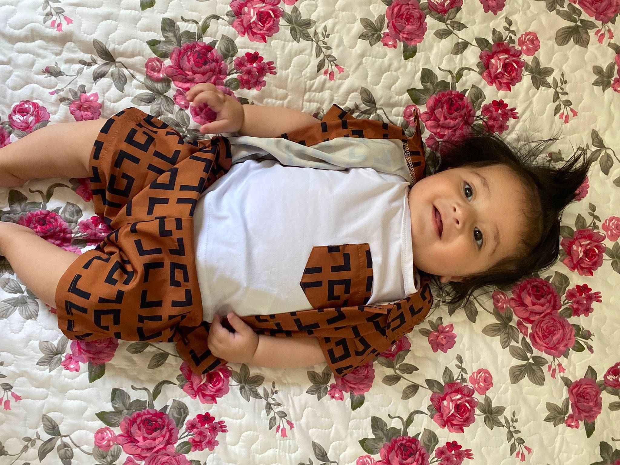 Antonia joined the competition — help win amazing prizes! baby_toddler_clothing, child, facial_expression, fashion_accessory, happy, human_leg, leg, linens, magenta, pattern, person, petal, pink, plant, product, skin, sleeve, smile, textile, thigh