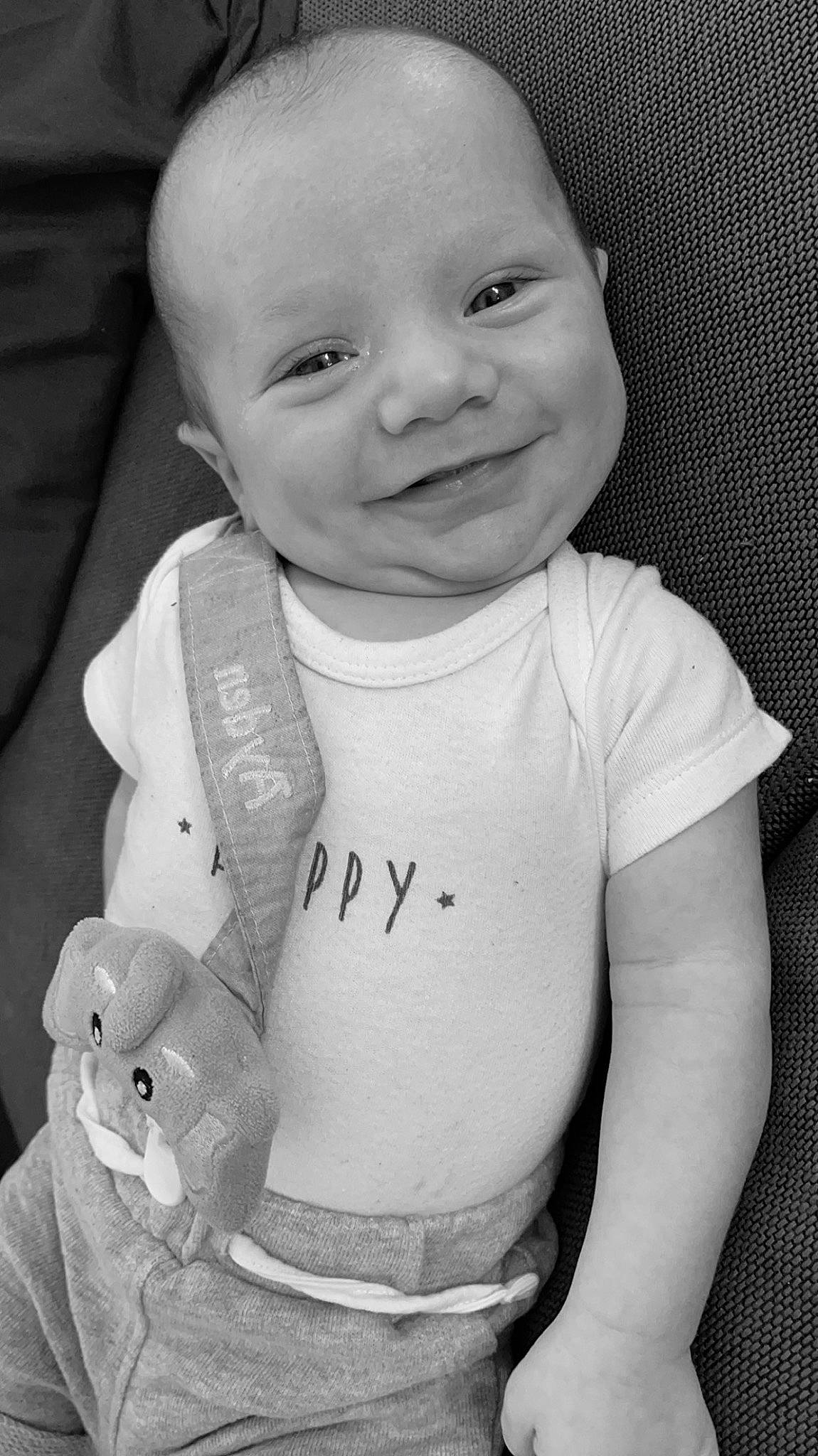 Ayden participe au concours pour gagner de l'argent avec cette photo : baby, baby_toddler_clothing, cheek, facial_expression, gesture, happy, human, iris, joy, lip, neck, organ, person, photograph, shoulder, skin, sleeve, smile, standing, t_shirt