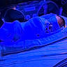 baby, incubator, hospital, phototherapy, blue_light, mesh_blanket, pacifier, eye_mask, newborn, medical_equipment, infant, sleeping, healthcare, nursery, patient, swaddled, clinic, care, bed, rest