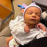 Jonas is registered to the contest to win money with this photo: newborn, baby, sleeping, infant, hospital, hat, diaper, clothing, person, hand, lap, cozy, cute, resting, skin, indoor, soft_lighting, peaceful, human, portrait