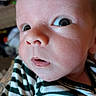 Gabriel is registered to the contest to win money with this photo: baby, infant, child, portrait, close_up, face, eyes, wide_eyes, curious, open_mouth, indoor, striped_clothing, green, white, skin, head, cheeks, nose, photography, expression