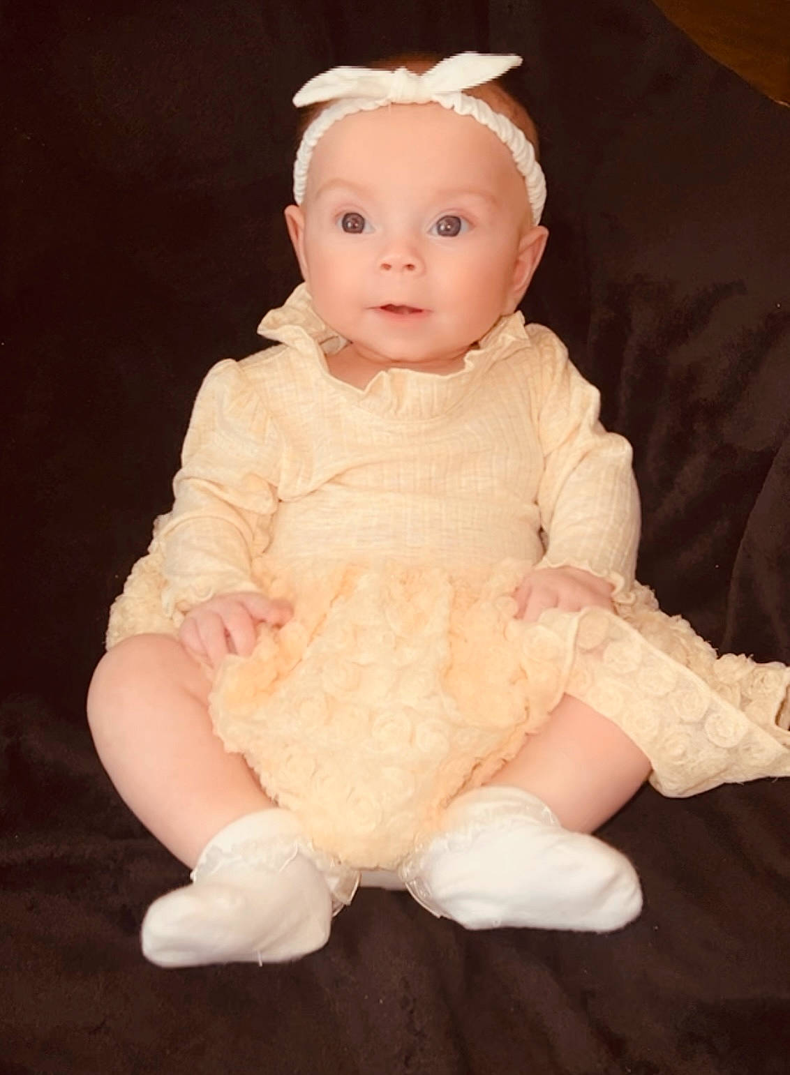 Mylah joined the competition — help win amazing prizes! arm, baby, baby_toddler_clothing, cheek, dress, flash_photography, flooring, fur, gesture, head, headgear, headpiece, human_body, iris, peach, person, pink, sitting, sleeve, thumb