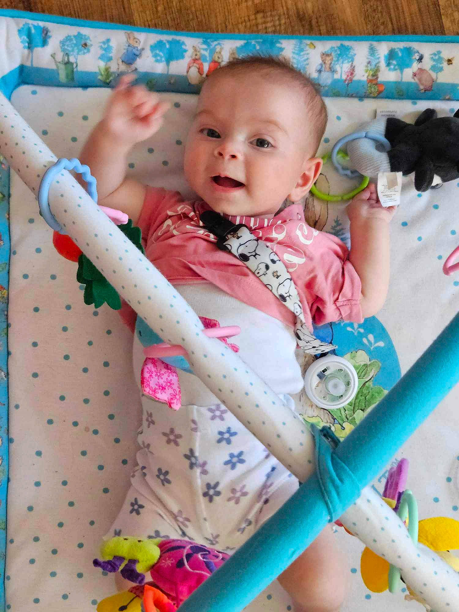 Mylah is registered to the contest to win money with this photo: baby, baby_products, baby_safety, baby_toddler_clothing, cheek, child, eye, face, fun, happy, human_body, linens, pattern, person, pink, play, skin, sleeve, smile, textile