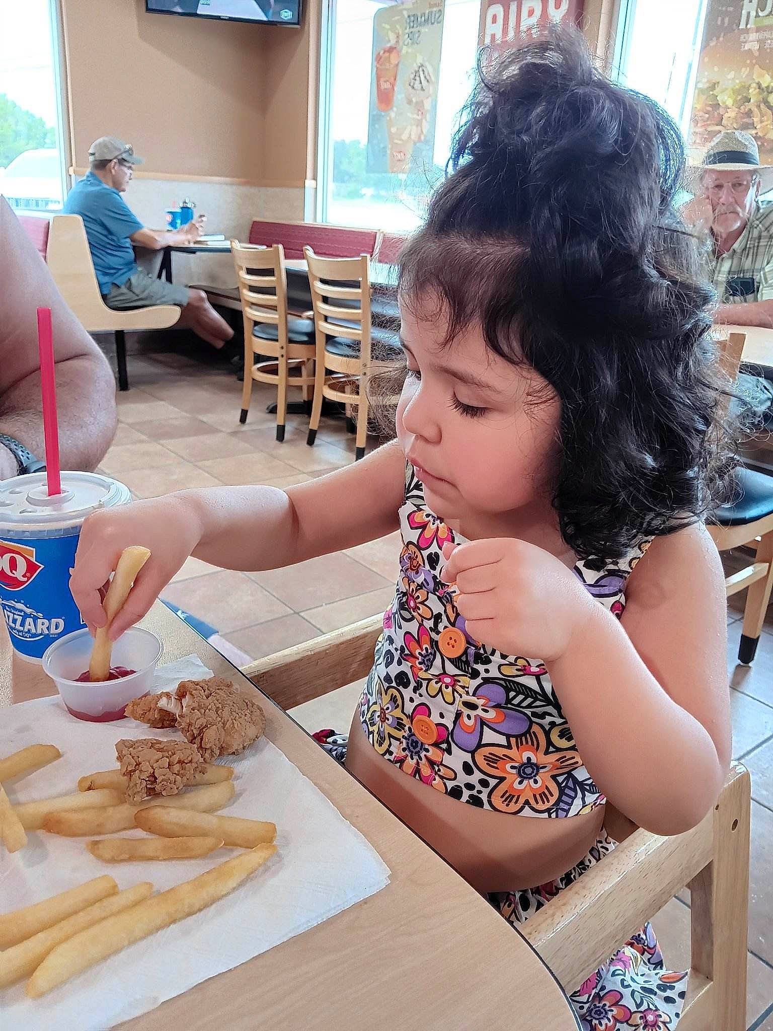 Bella is registered to the contest to win money with this photo: breakfast, chair, child, comfort_food, cuisine, desk, eating, finger_food, food, headwear, junk_food, leisure, person, plate, play, recreation, summer, table, tableware, toddler