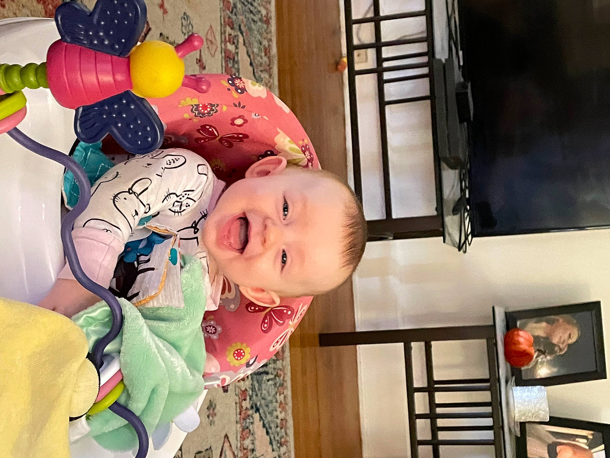 Cassandra is registered to the contest to win money with this photo: baby, baby_products, baby_toddler_clothing, balloon, cheek, child, fun, happy, human_body, party_supply, pattern, person, picture_frame, play, room, smile, toddler, wood