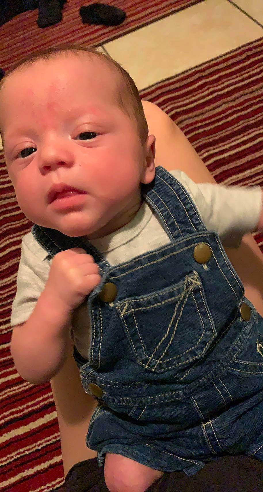 Steven is registered to the contest to win money with this photo: arm, baby_toddler_clothing, cheek, eyelash, face, finger, gesture, hand, head, human_body, iris, joint, lip, mouth, muscle, neck, nose, person, shoulder, skin