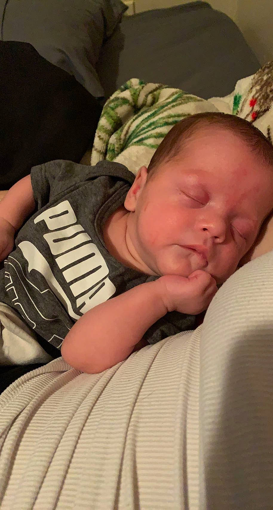 Steven is registered to the contest to win money with this photo: baby, baby_sleeping, baby_toddler_clothing, bedtime, cheek, comfort, elbow, eye, hand, human, human_body, linens, mammal, mouth, nose, person, skin, sleeve, textile, thumb