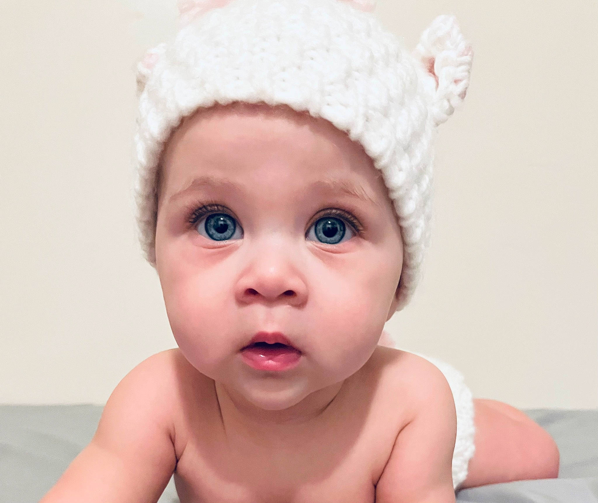 Scarlett is registered to the contest to win money with this photo: baby, baby_bathing, baby_toddler_clothing, bathing, cap, cheek, chin, ear, eye, eyebrow, eyelash, gesture, happy, head, headwear, lip, nose, person, pink, skin