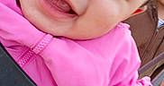 Carmine is registered to the contest to win money with this photo: baby, child, closeup, cute, daylight, face, fun, grass, happy, jacket, outdoor, park, person, pink_jacket, playground, portrait, smiling, swing, teeth, young_child