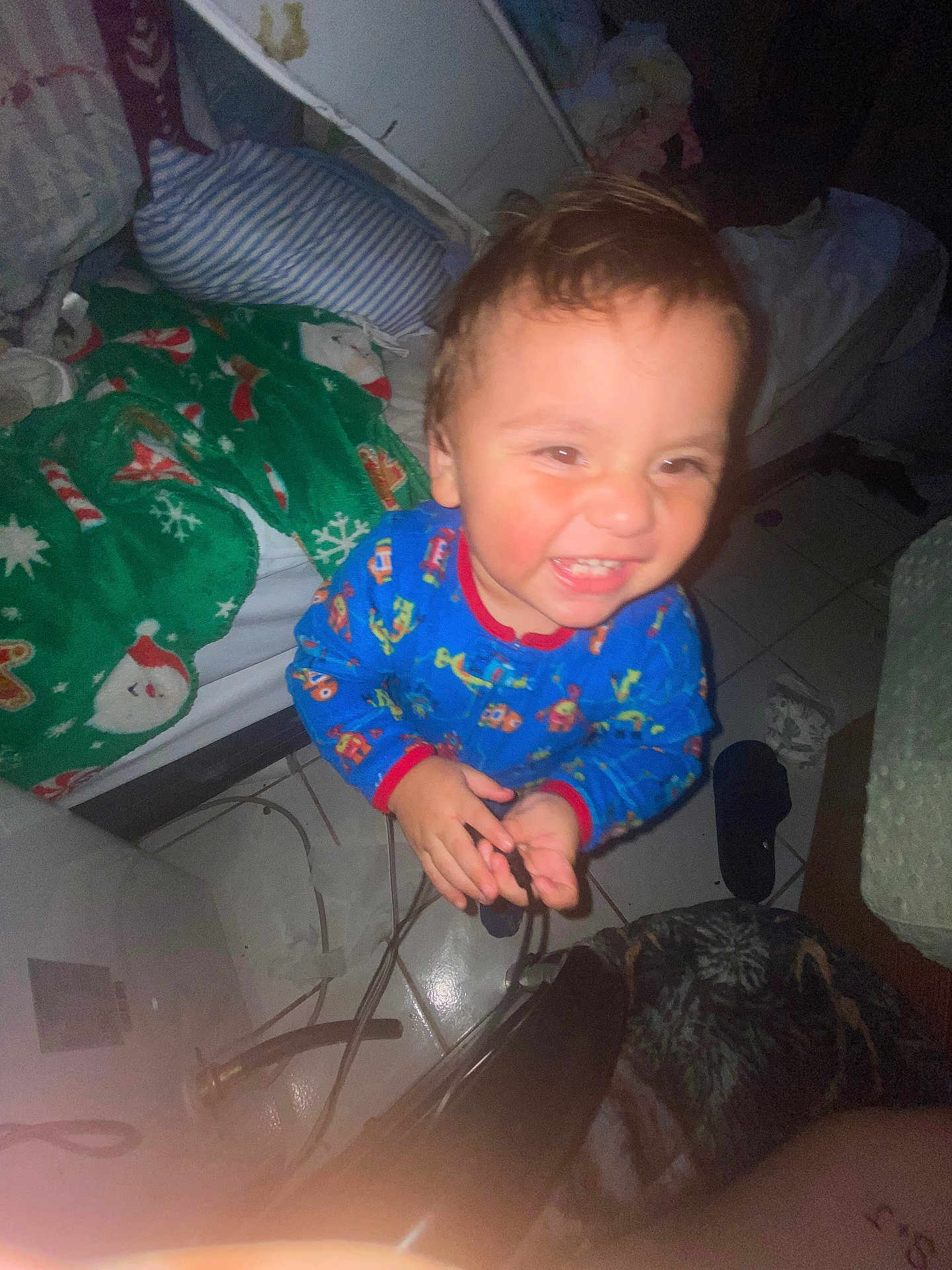 Nathan joined the competition — help win amazing prizes! toddler, child, smiling, pajamas, indoor, blanket, floor, tile, bed, clutter, happy, person, face, room, footwear, furniture, cord, hand, expression, home