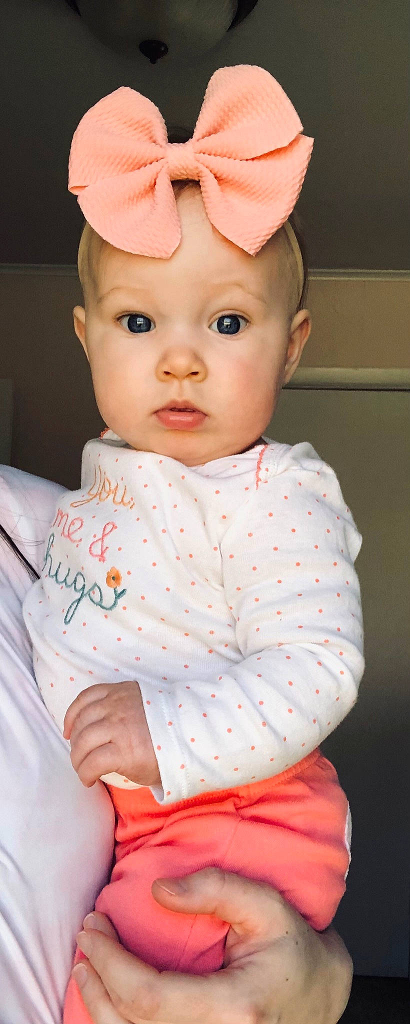 Maisy is registered to the contest to win money with this photo: baby_toddler_clothing, cap, cheek, clothing, collar, dress, eye, eyebrow, eyelash, face, head, headwear, iris, lip, neck, nose, person, pink, skin, sleeve