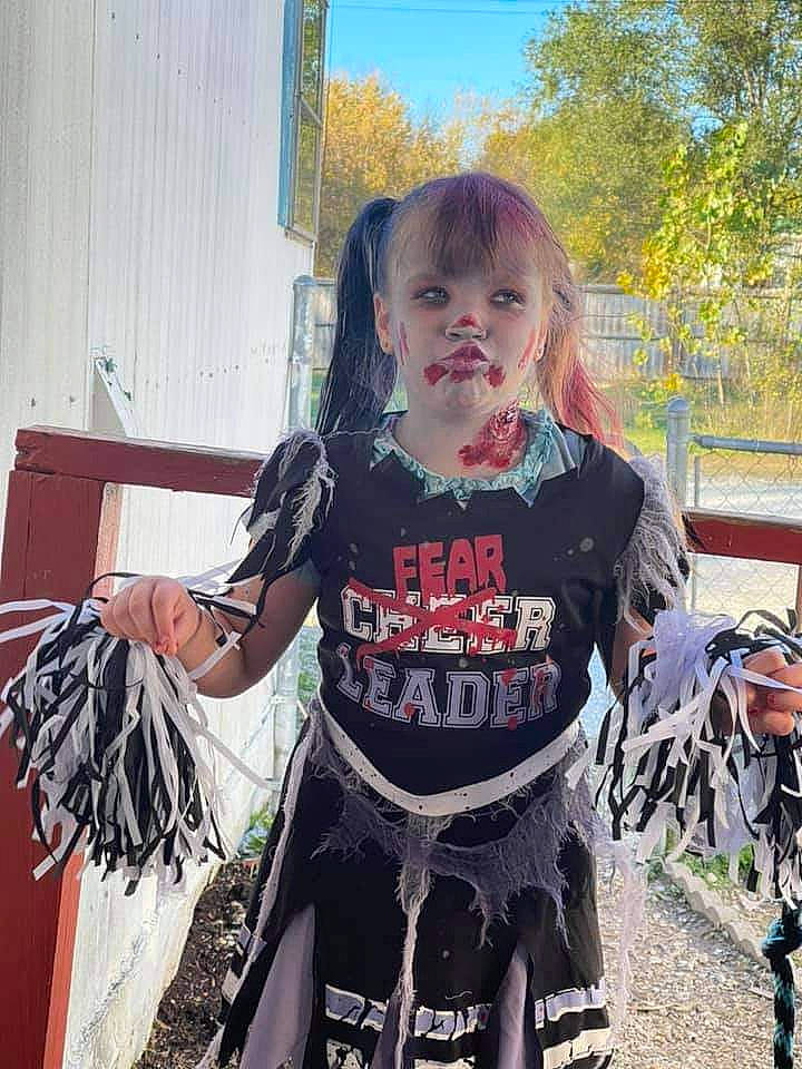 Juelee is registered to the contest to win money with this photo: bangs, dress, flesh, fun, grass, hair, happy, luggage_and_bags, pattern, person, personal_protective_equipment, plant, recreation, sitting, sleeve, sportswear, street_fashion, t_shirt, toddler, tree