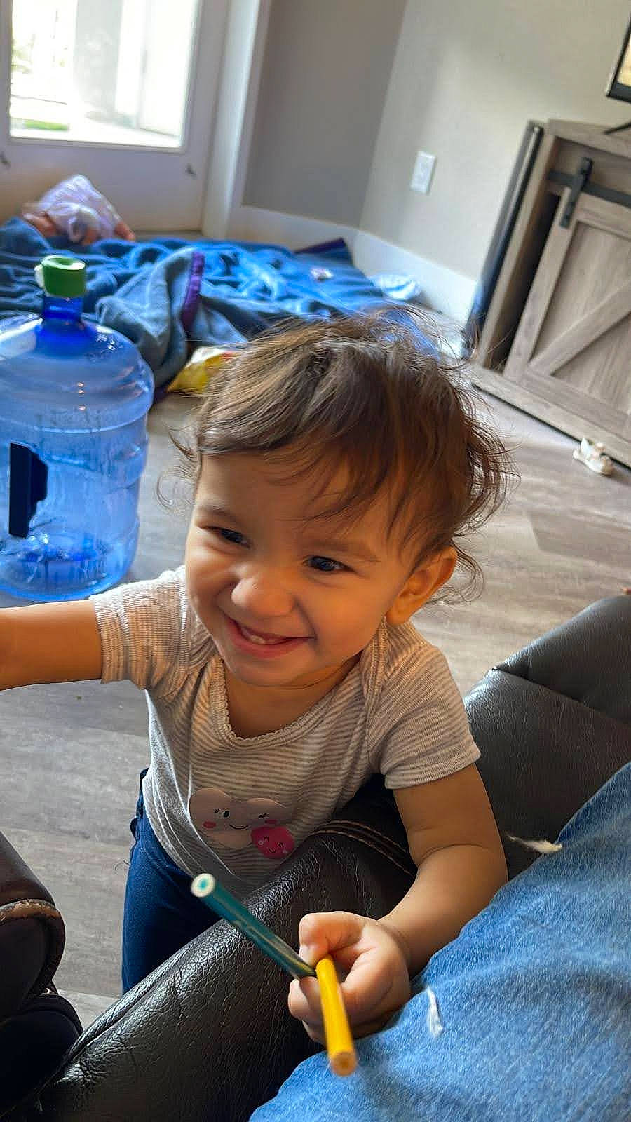 Emma joined the competition — help win amazing prizes! baby, blue, bottle, bottled_water, child, drinking_water, finger, fun, hairstyle, hand, happy, joy, leisure, mineral_water, person, plastic_bottle, sitting, skin, smile, toddler