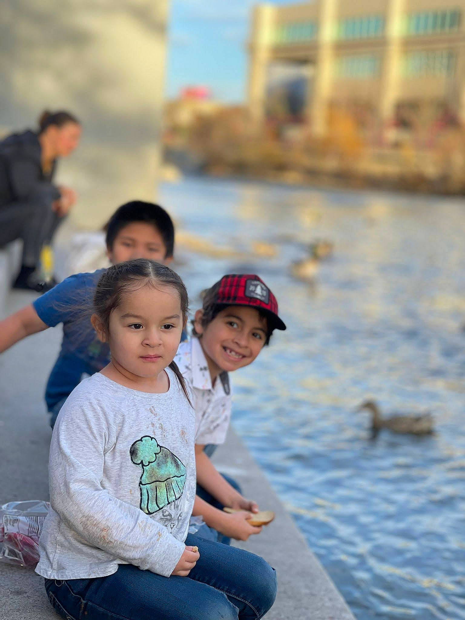 Emely joined the competition — help win amazing prizes! _geese_and_swans, blurred, child, city, ducks, event, fun, happy, headwear, human, joy, lake, leisure, person, recreation, sitting, street, summer, t_shirt, toddler
