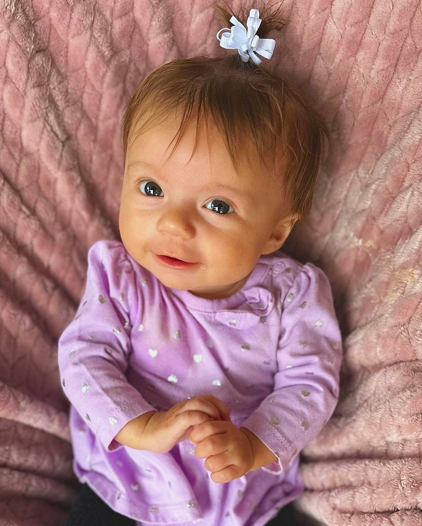 Fallon joined the competition — help win amazing prizes! baby, baby_toddler_clothing, cheek, child, eye, hair, happy, head, iris, magenta, organ, person, pink, purple, skin, sleeve, smile, textile, toddler, violet