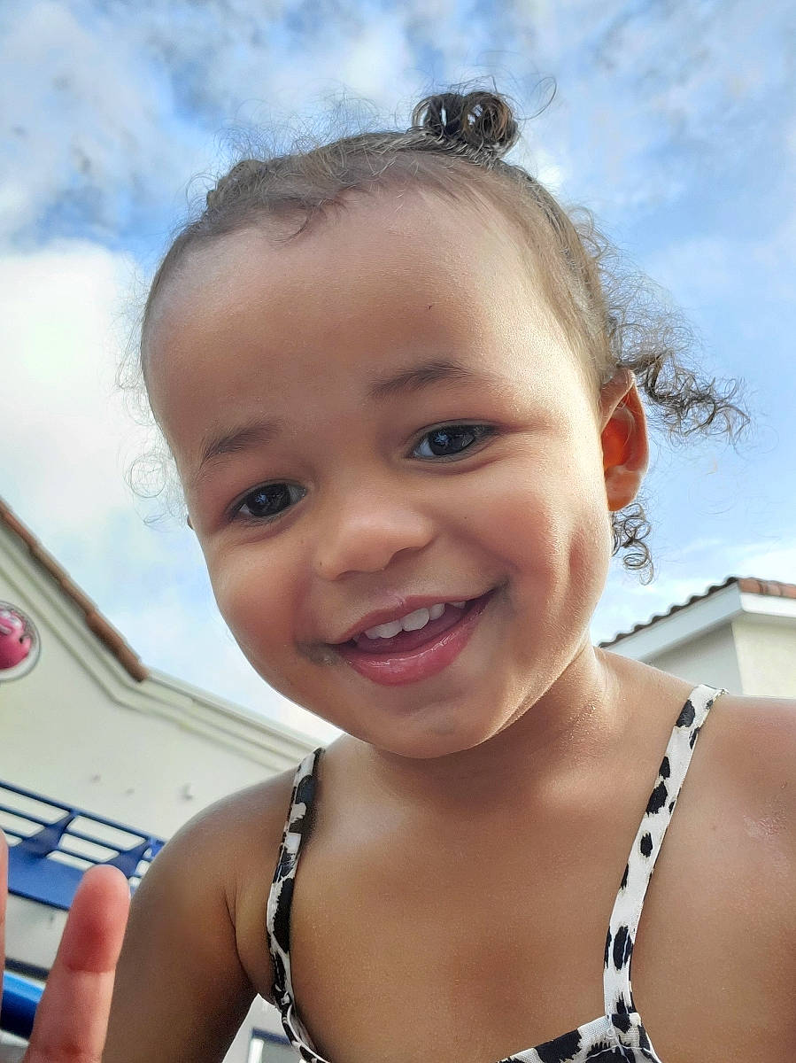 Lena is registered to the contest to win money with this photo: cheek, child, chin, eyebrow, face, facial_expression, forehead, fun, hair, happy, head, joy, lip, neck, nose, person, skin, smile, summer, toddler