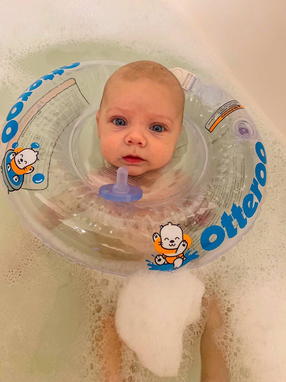 Boone is registered to the contest to win money with this photo: baby, baby_bathing, bathing, bathtub, cheek, chest, child, eye, eyebrow, facial_expression, fun, hairstyle, head, headgear, iris, neck, person, skin, stomach, textile
