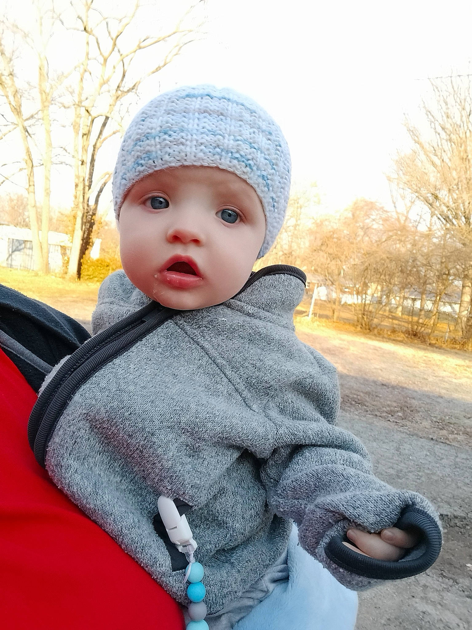 Gage joined the competition — help win amazing prizes! baby, baby_toddler_clothing, cap, child, electric_blue, freezing, fur, grey, happy, headgear, headwear, knit_cap, outerwear, pattern, person, sky, sleeve, standing, toddler, tree
