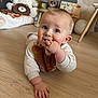 Timéo participe au concours pour gagner de l'argent avec cette photo : baby, child, crawling, floor, wooden_floor, indoors, toy, teddy_bear, plush_toy, hand, face, blue_eyes, clothing, sweater, cute, smiling, room, lamp, decor, childhood