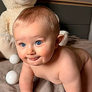 Timéo a rejoint le concours — aidez-le/la à gagner de superbes lots ! baby, blue_eyes, crawling, cute, face, fluffy_toy, indoor, light_skin, plush_toy, portrait, smiling, soft_texture, teddy_bear, toy, toddler, young_child, blanket, bed, hand, child