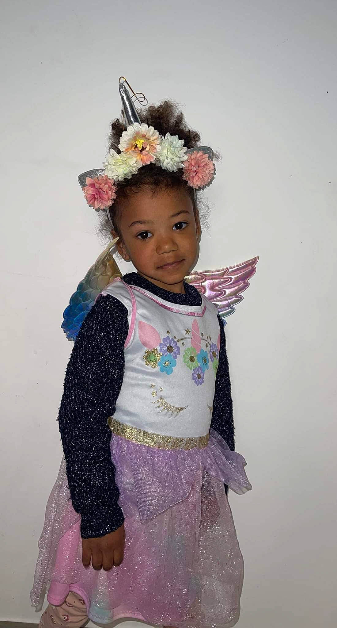 Lilyah participe au concours pour gagner de l'argent avec cette photo : baby_toddler_clothing, day_dress, embellishment, eye, face, fashion_design, flower, happy, head, headgear, headpiece, iris, jewellery, magenta, person, pink, purple, skin, sleeve, smile