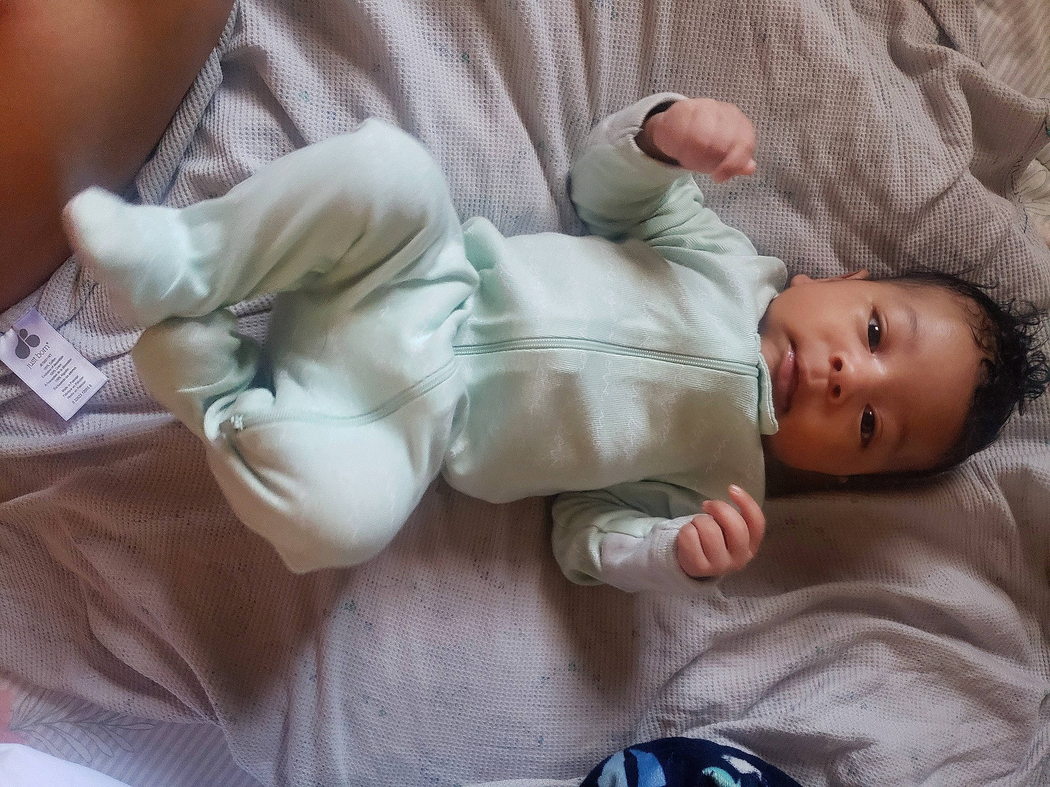 Malachi is registered to the contest to win money with this photo: baby, baby_products, baby_sleeping, baby_toddler_clothing, bedtime, child, comfort, facial_expression, gesture, hand, head, linens, mammal, person, room, sitting, skin, sleeve, textile, thumb