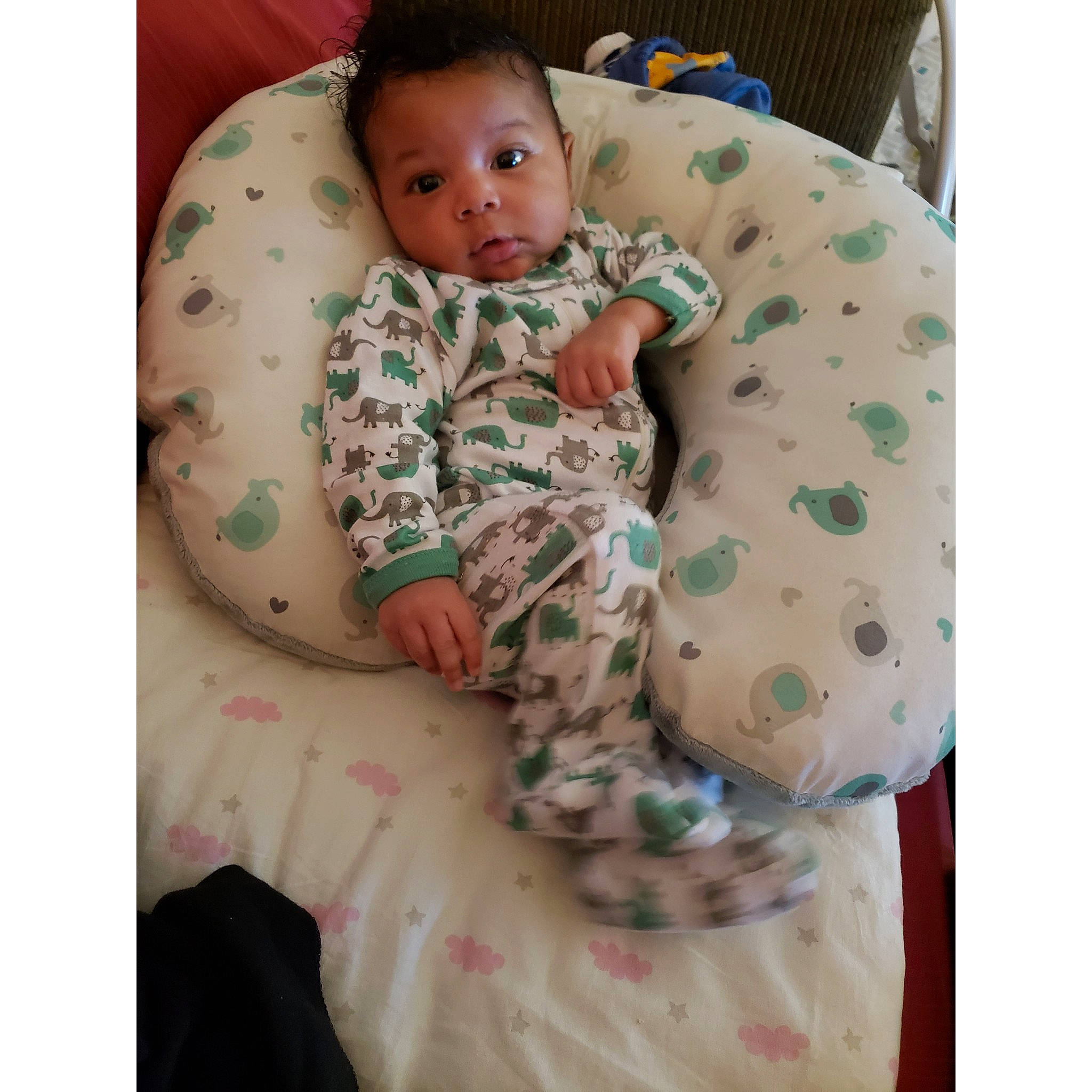 Malachi is registered to the contest to win money with this photo: abdomen, arm, baby, baby_products, baby_safety, baby_sleeping, baby_toddler_clothing, bedding, child, comfort, head, linens, neck, organ, pattern, person, product, skin, sleeve, textile