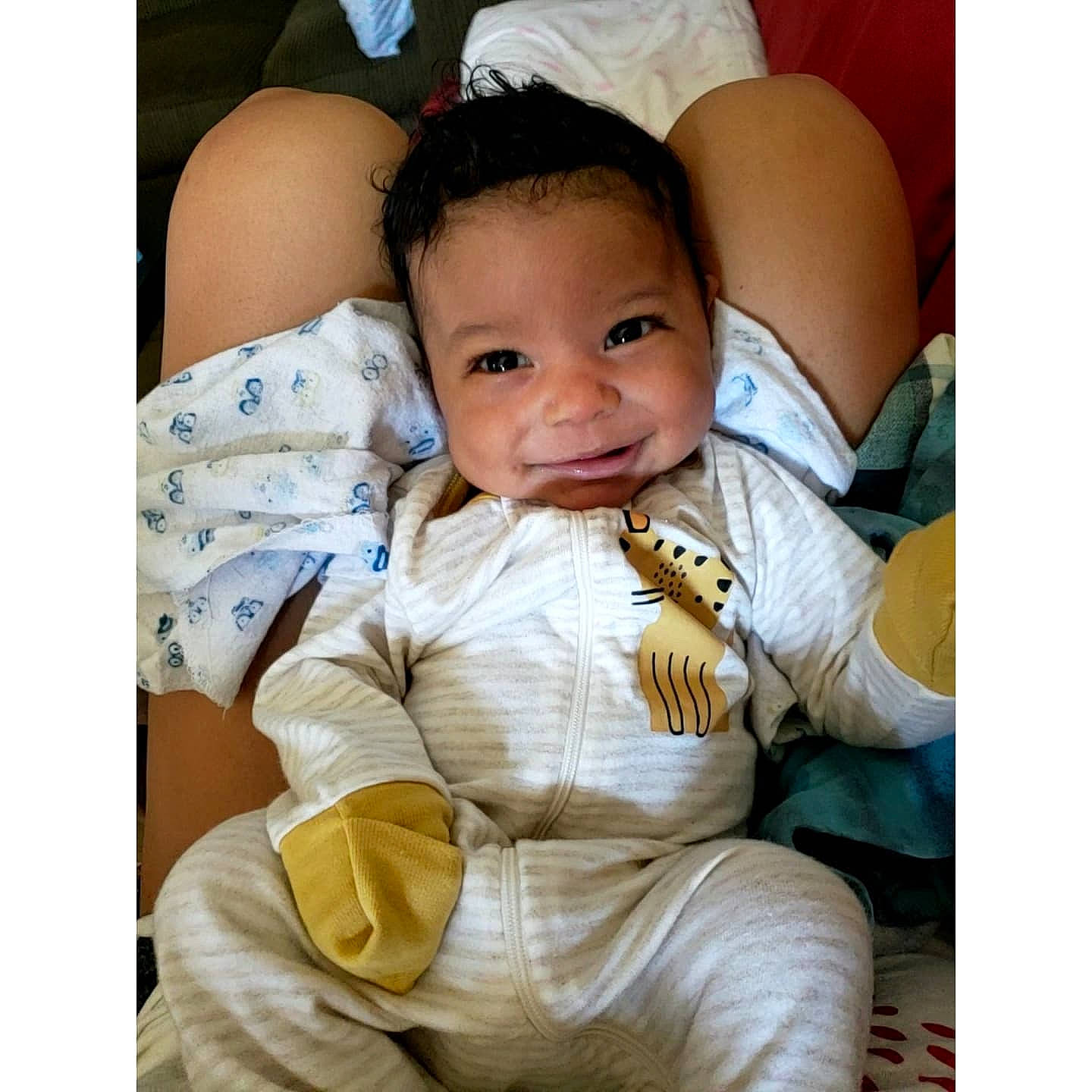 Malachi joined the competition — help win amazing prizes! abdomen, baby, baby_toddler_clothing, cheek, chest, comfort, face, flash_photography, gesture, hand, happy, head, joy, linens, person, product, skin, sleeve, smile, textile