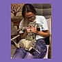 affection, cat, chair, comfort, furniture, glasses, hands, happy, home, indoor, lap, leggings, person, pet, relaxed, sitting, smile, tabby_cat, tree_decal, tshirt