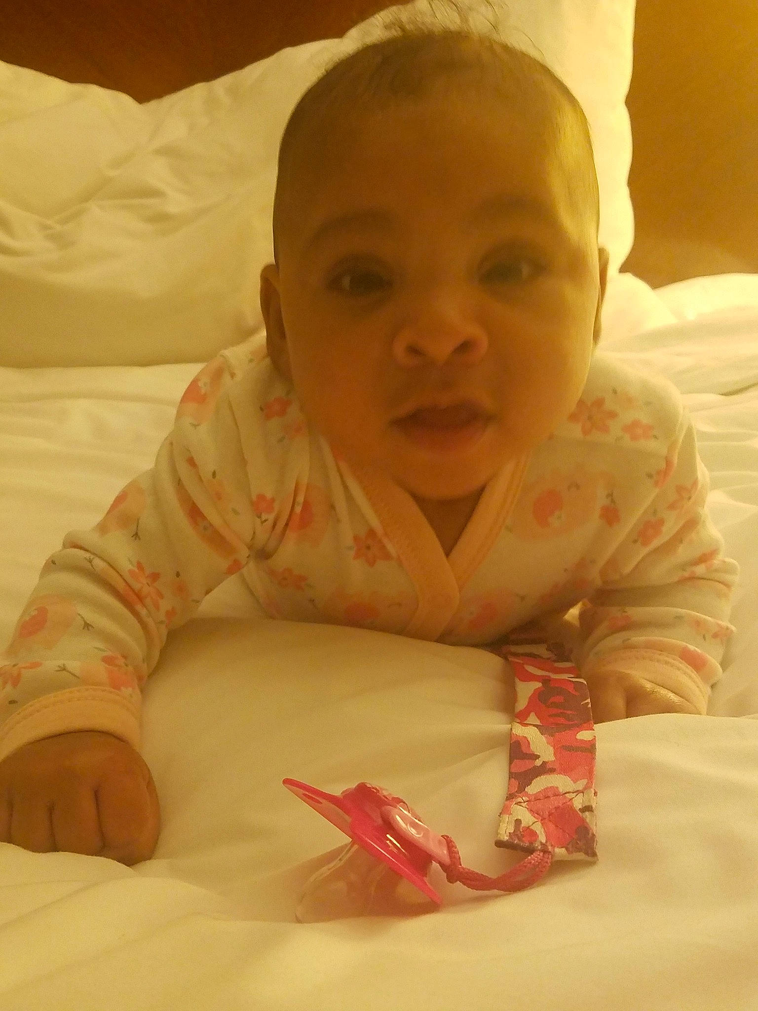 Adriannah is registered to the contest to win money with this photo: baby, cheek, child, face, finger, fun, head, lip, mouth, nose, person, pink, skin, smile, toddler, tummy_time