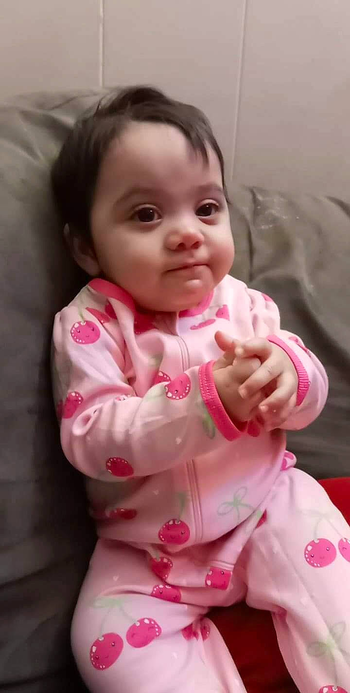 Ariah is registered to the contest to win money with this photo: baby, baby_products, baby_toddler_clothing, cheek, child, comfort, eyelash, finger, fun, gesture, hand, happy, lip, nose, person, pink, sitting, skin, sleeve, thumb