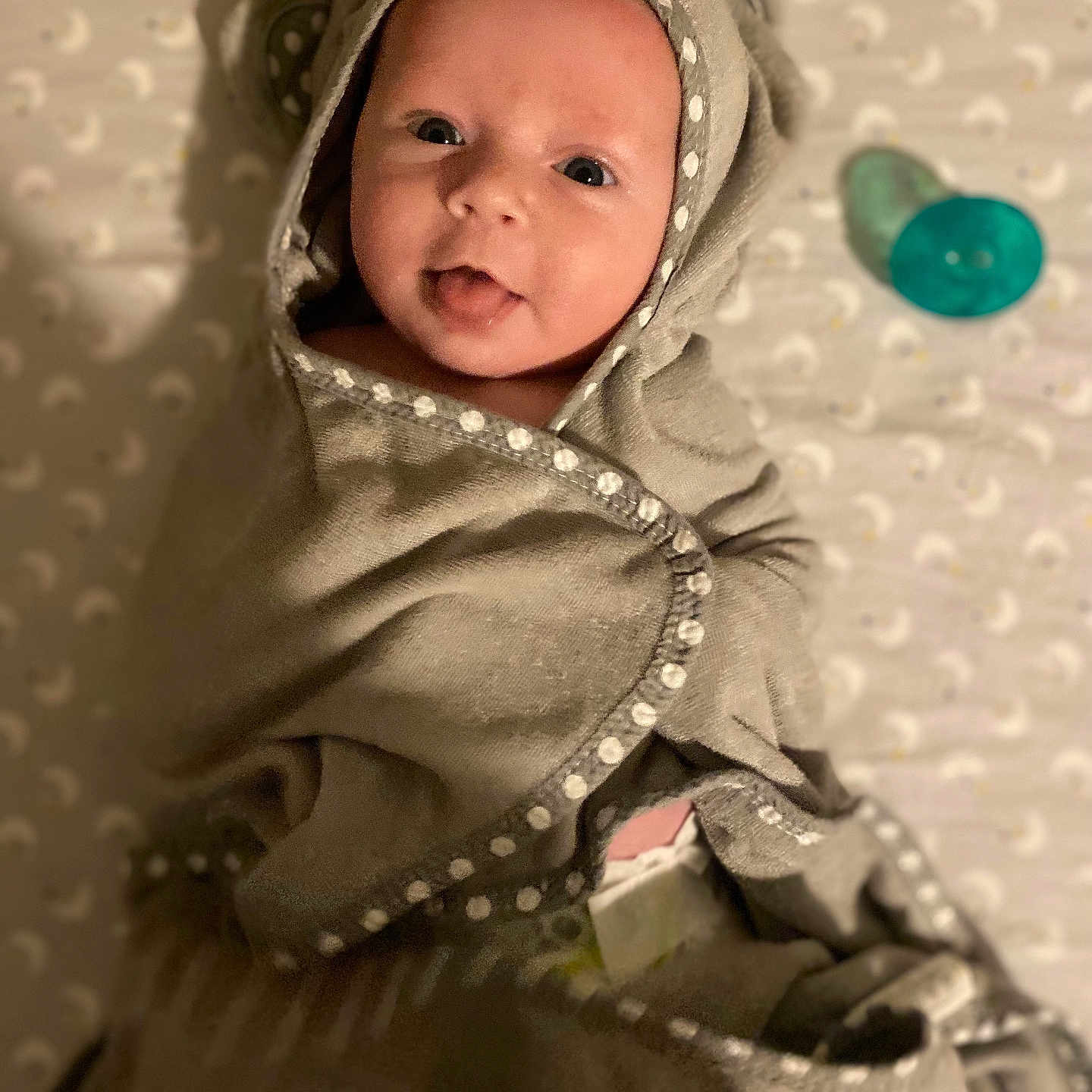 Isabella is registered to the contest to win money with this photo: baby, blanket, bonnet, clothing, coat, face, happy, hat, head, hood, hoodie, jacket, knitwear, newborn, person, photography, portrait, smile, sweater, sweatshirt