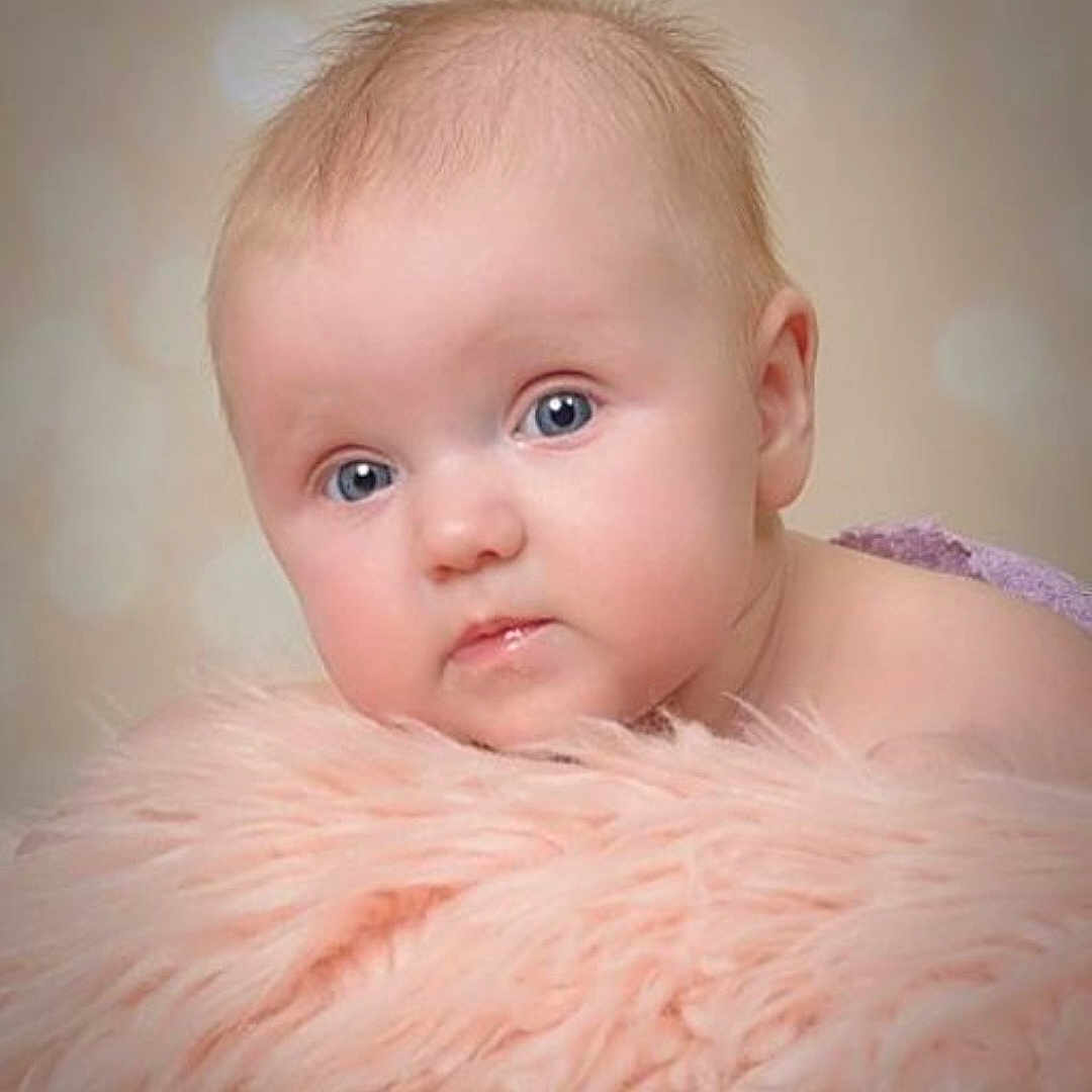 Lily joined the competition — help win amazing prizes! baby, baby_hair, background_blur, blue_eyes, child, close_up, cute, expression, face, fluffy_blanket, head, infant, innocence, laying_down, newborn, pink, portrait, resting, skin, soft_texture