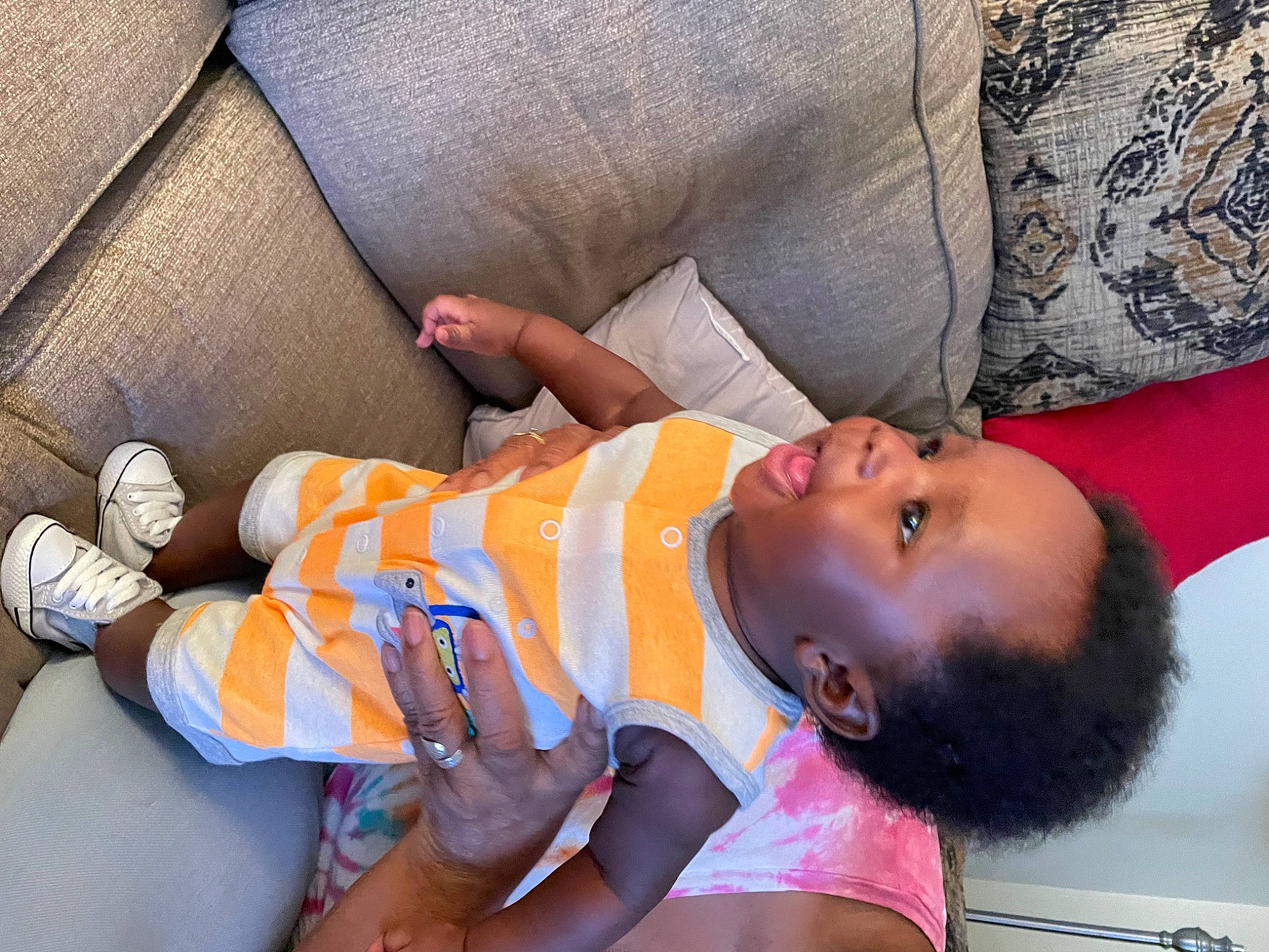 Syncere is registered to the contest to win money with this photo: abdomen, arm, baby, chest, child, comfort, elbow, finger, happy, human_leg, joint, leisure, navel, nose, orange, person, skin, textile, thigh, toddler