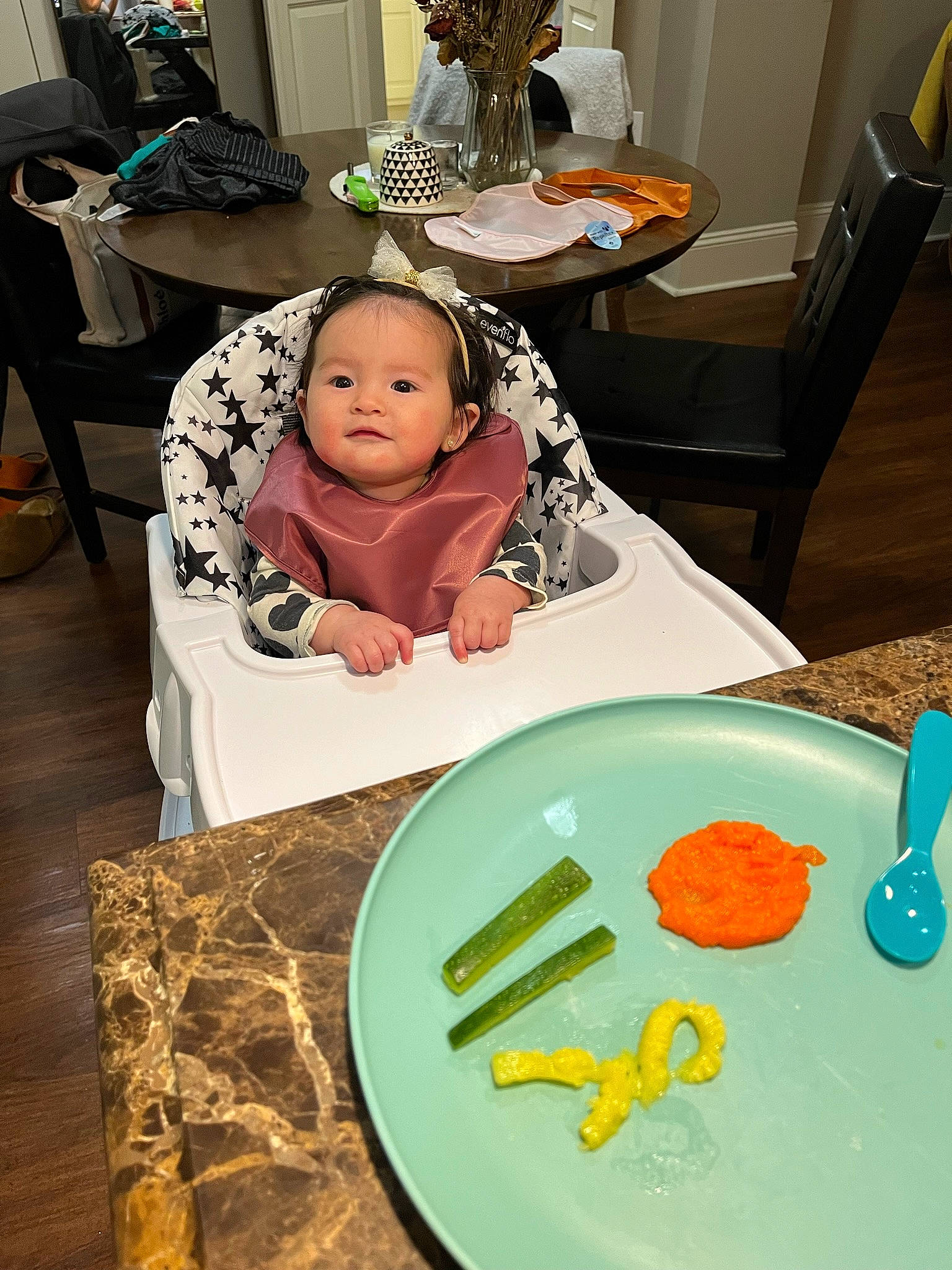 Vienna is registered to the contest to win money with this photo: baby, baby_toddler_clothing, chair, child, cooking, cutlery, dishware, event, furniture, ingredient, kitchen_utensil, paint, person, plate, recipe, room, sweetness, table, tableware, textile
