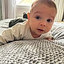 Jude participe au concours pour gagner de l'argent avec cette photo : baby, infant, bed, blanket, pattern, sweater, face, eyes, curious, indoors, window, soft_light, skin, hair, person, portrait, lying_down, child, cozy, room