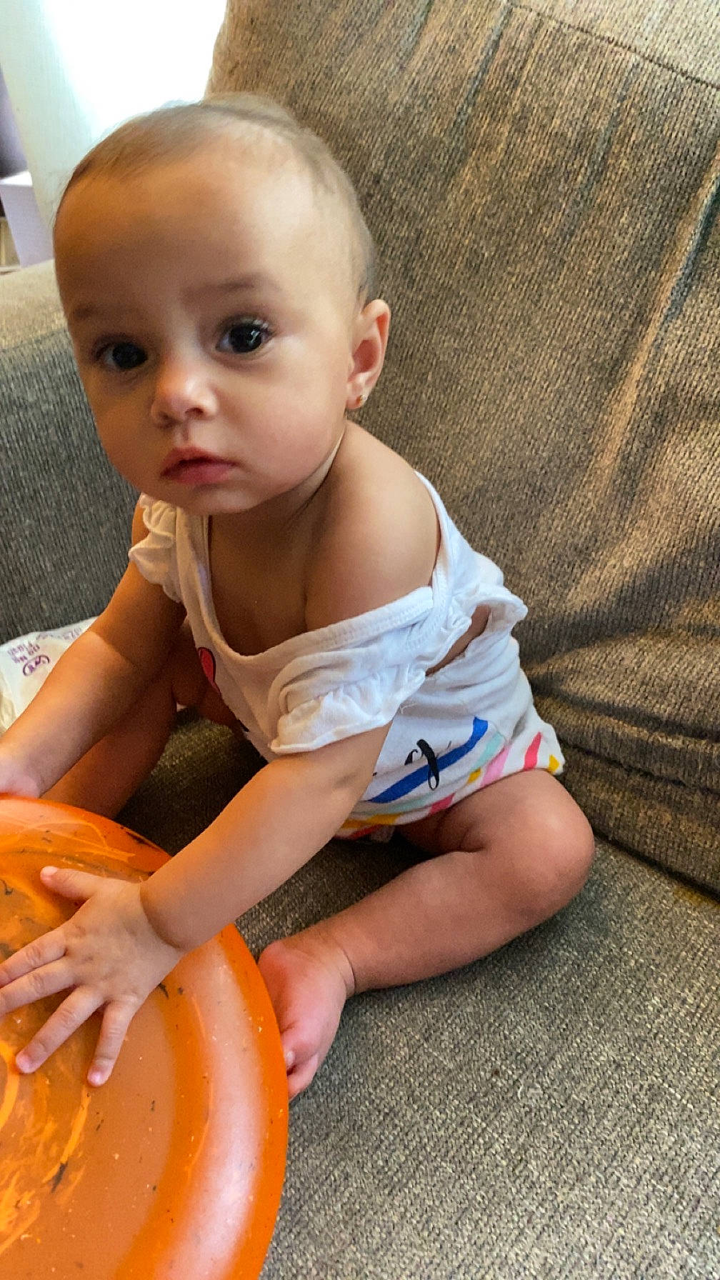 Armoni is registered to the contest to win money with this photo: arm, baby, baby_toddler_clothing, calabaza, child, cucurbita, finger, foot, fun, gourd, grass, hand, human_leg, person, pumpkin, shorts, sitting, skin, thigh, toddler