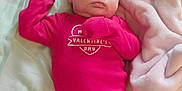 Madilynn joined the competition — help win amazing prizes! baby, sleeping, infant, pink_clothing, valentines_day, striped_pants, blanket, bed, soft, cute, cozy, child, newborn, resting, face, person, apparel, indoors, peaceful, comfort