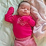baby, sleeping, infant, pink_clothing, valentines_day, striped_pants, blanket, bed, soft, cute, cozy, child, newborn, resting, face, person, apparel, indoors, peaceful, comfort
