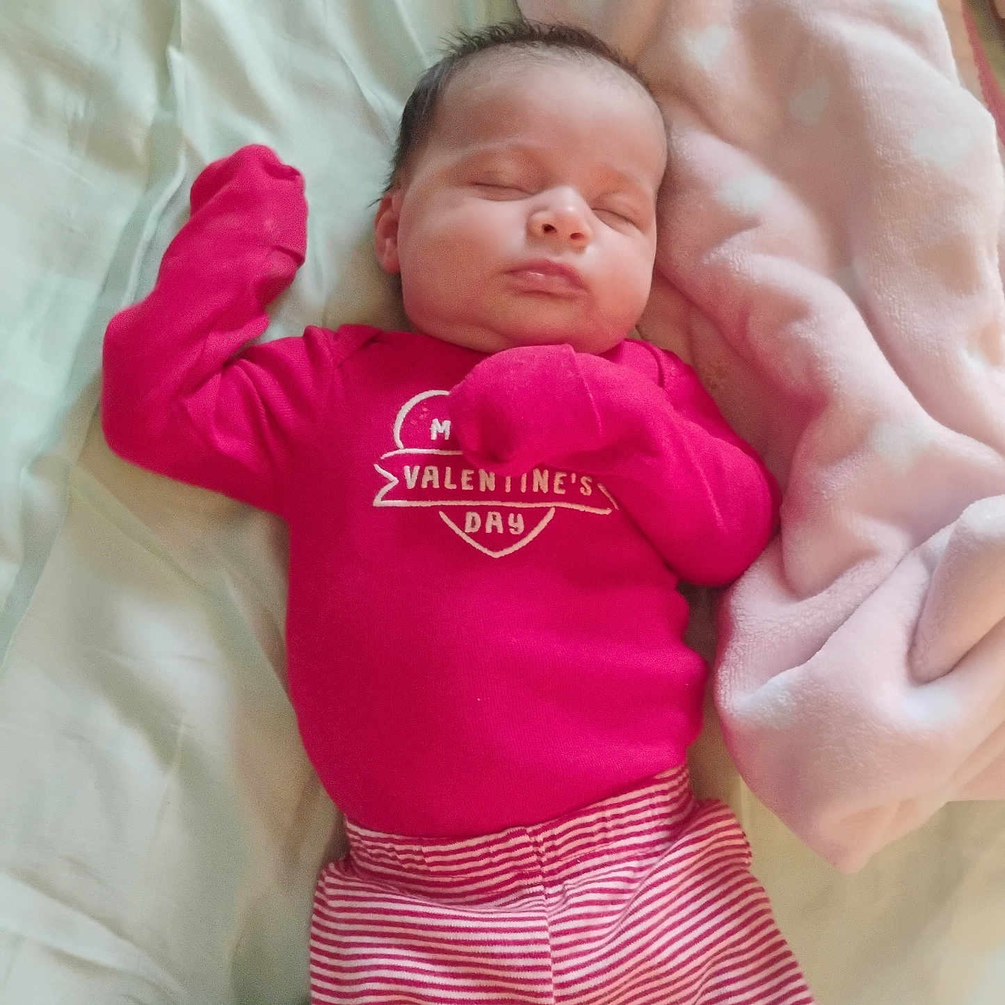 Madilynn joined the competition — help win amazing prizes! apparel, baby, bed, blanket, child, comfort, cozy, cute, face, indoors, infant, newborn, peaceful, person, pink_clothing, resting, sleeping, soft, striped_pants, valentines_day