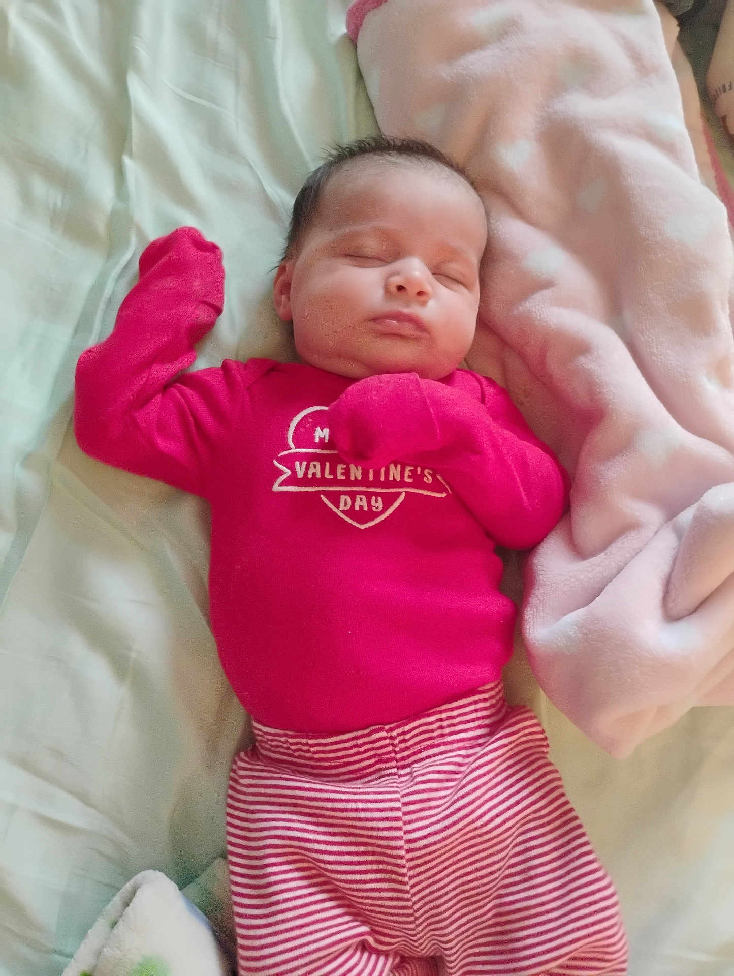 Madilynn joined the competition — help win amazing prizes! baby, sleeping, infant, pink_clothing, valentines_day, striped_pants, blanket, bed, soft, cute, cozy, child, newborn, resting, face, person, apparel, indoors, peaceful, comfort
