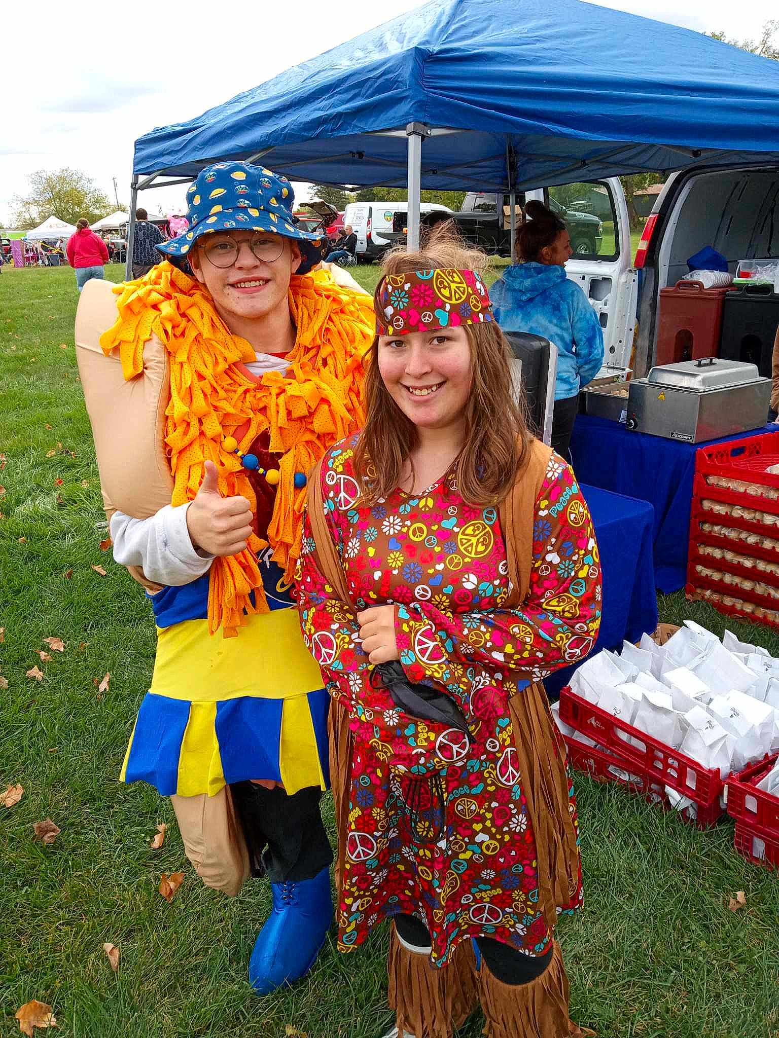 Jalena is registered to the contest to win money with this photo: canopy, child, event, fun, grass, handbag, happy, hat, headwear, joy, leisure, luggage_and_bags, market, necklace, person, public_event, recreation, sandal, smile, social_group