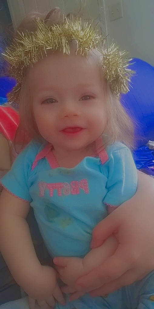 La'Chell Faith is registered to the contest to win money with this photo: azure, baby_toddler_clothing, blue, cheek, cool, eye, face, gesture, hair, happy, head, headgear, iris, lip, people_in_nature, person, pink, skin, sleeve, smile