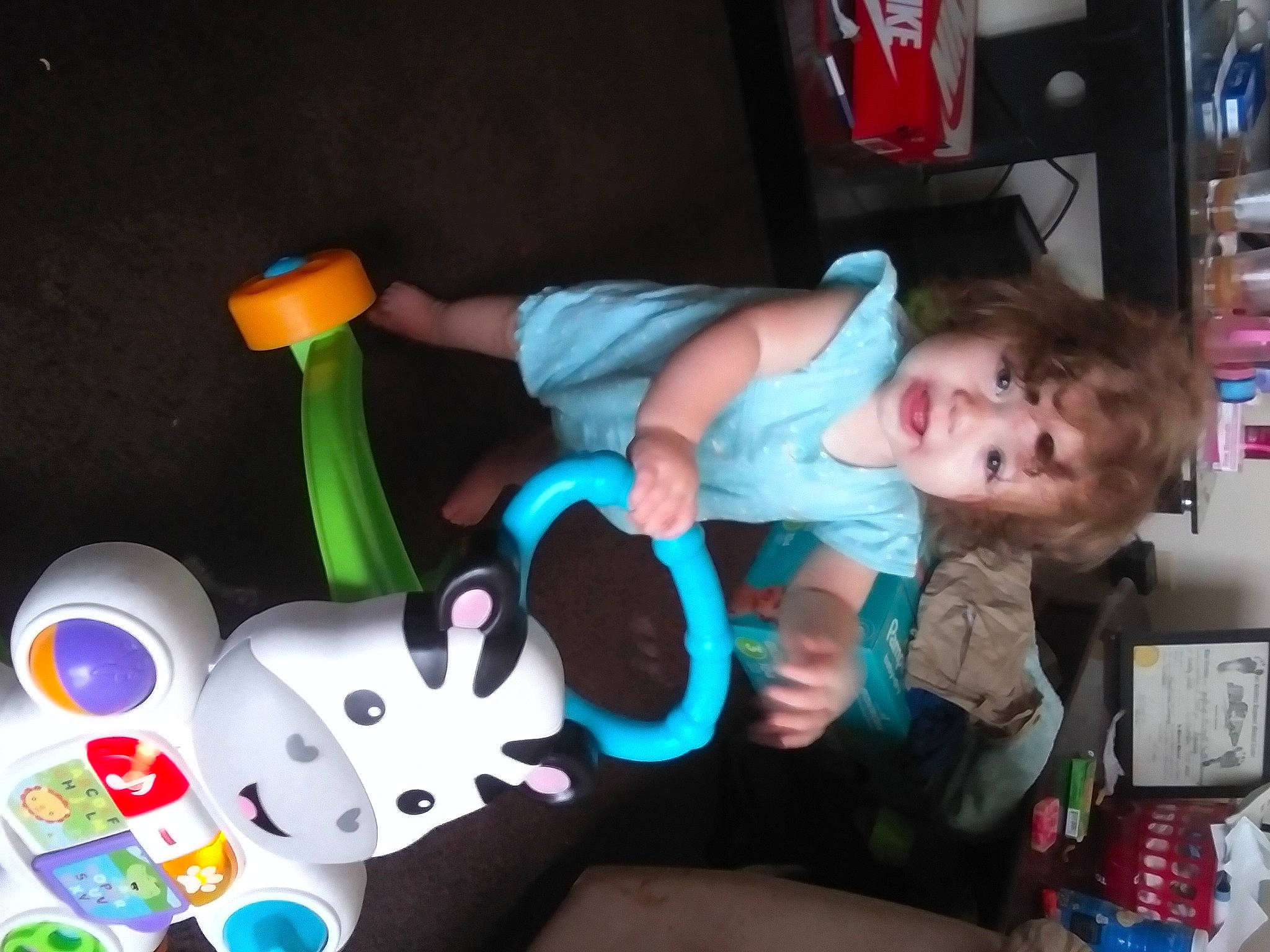 Jayleigh La'Chell is registered to the contest to win money with this photo: animation, baby, baby_products, baby_toddler_clothing, baby_toys, child, fun, lap, person, plastic, play, room, sitting, t_shirt, toddler, toy