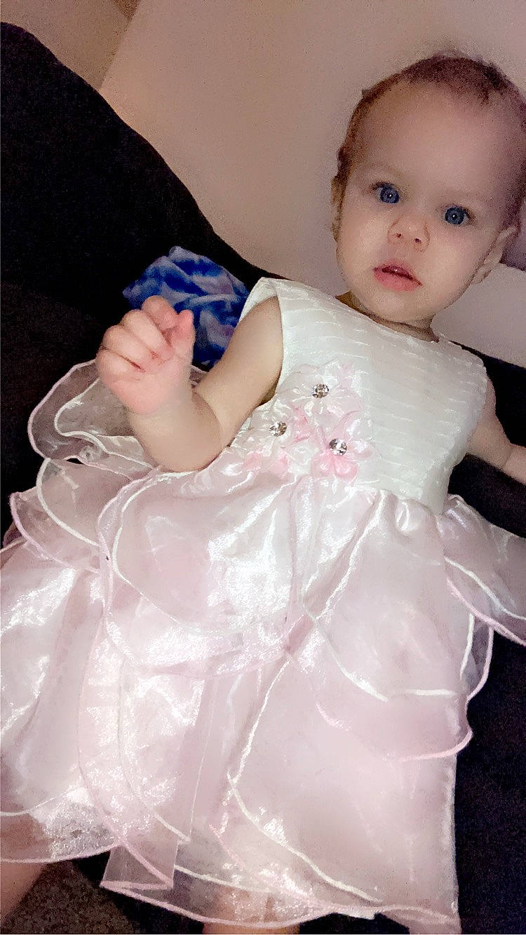 Rosalynn joined the competition — help win amazing prizes! abdomen, baby, baby_products, baby_toddler_clothing, child, comfort, day_dress, dress, embellishment, fashion_accessory, flash_photography, headpiece, iris, nail, person, pink, ruffle, sitting, skin, sleeve