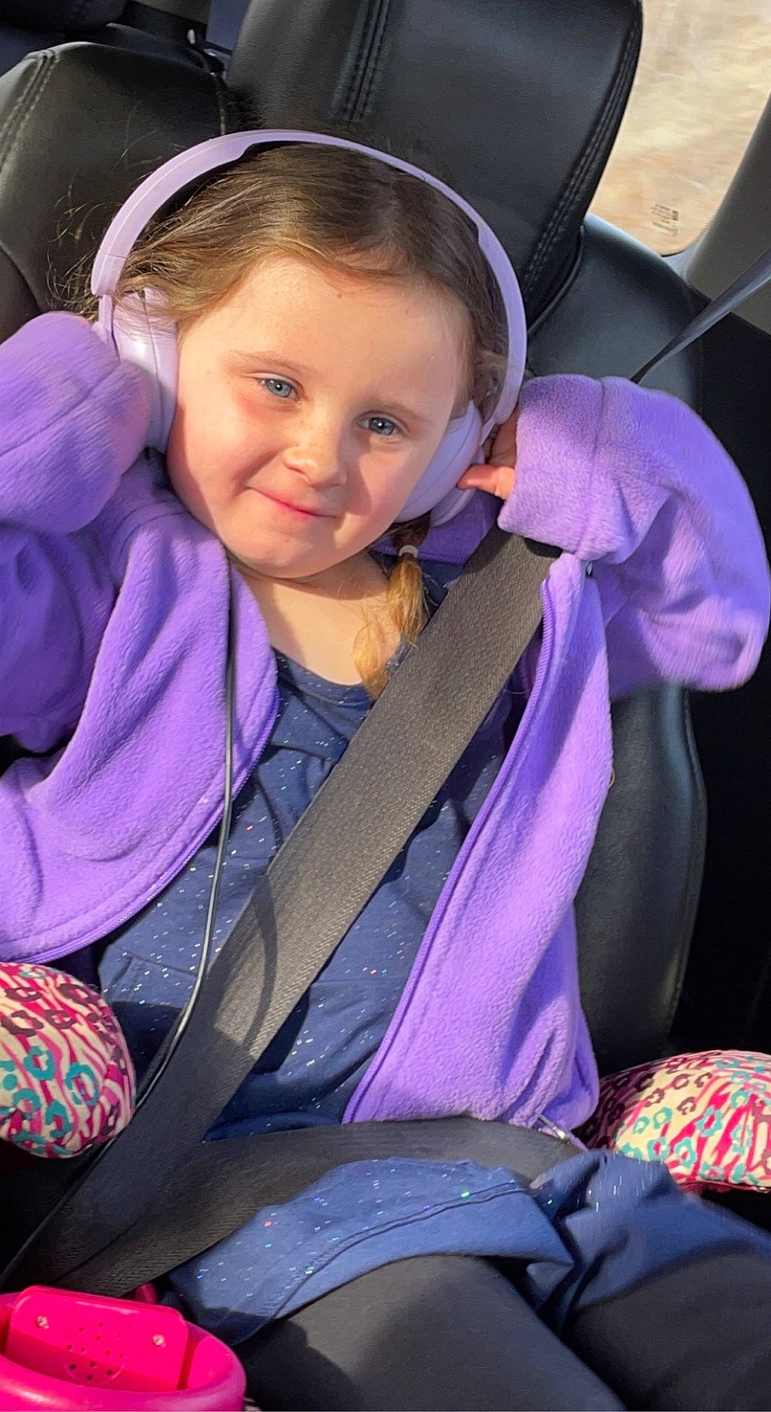 Daisy is registered to the contest to win money with this photo: auto_part, baby_carriage, baby_products, blond, child, electric_blue, face, happy, head, iris, joy, leisure, magenta, person, pink, purple, seat_belt, skin, smile, snapshot