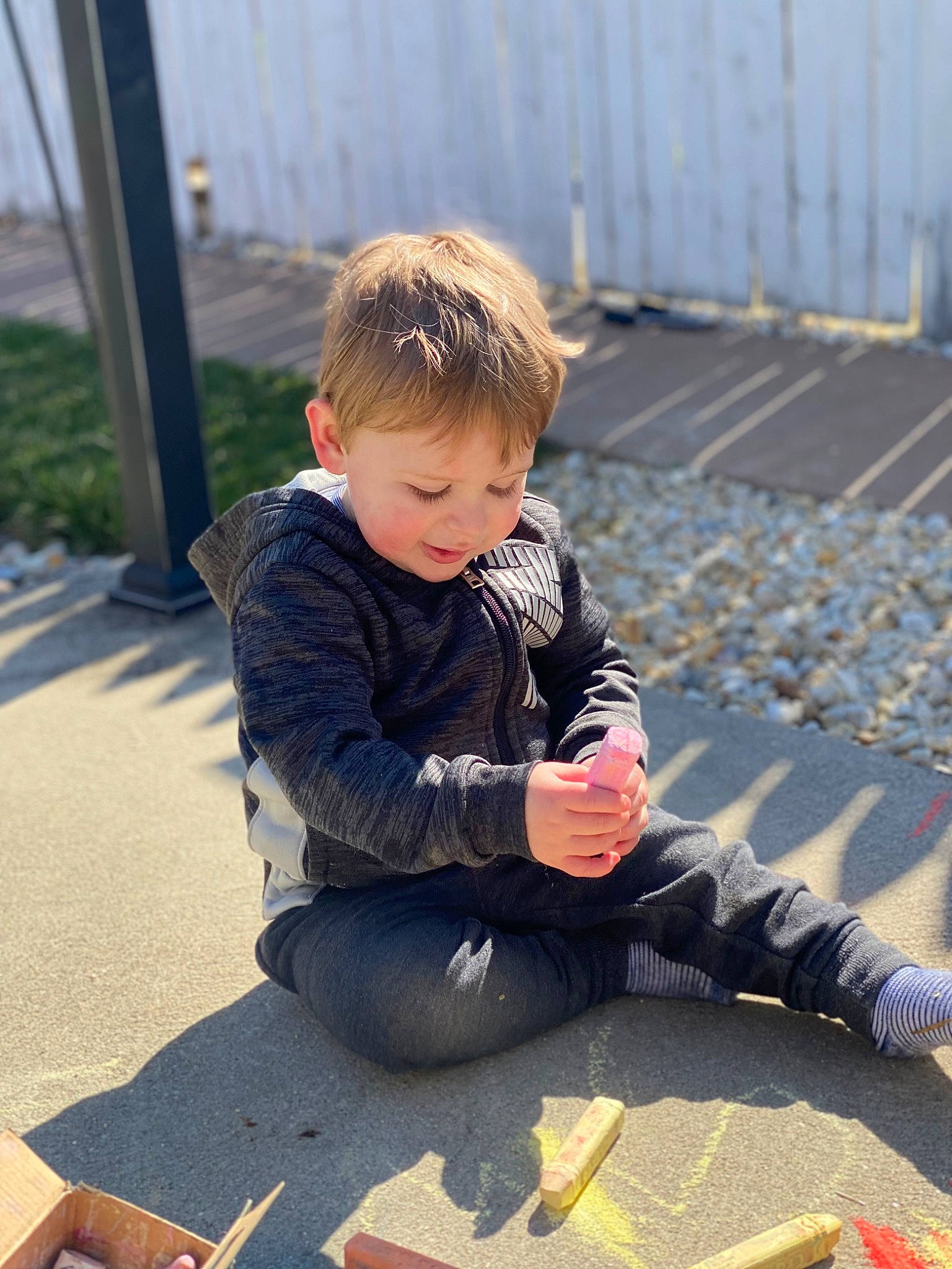 Maverick joined the competition — help win amazing prizes! asphalt, baby, child, city, fence, flooring, foot, fun, grass, happy, jeans, leg, leisure, person, play, recreation, road_surface, shadow, sitting, smile