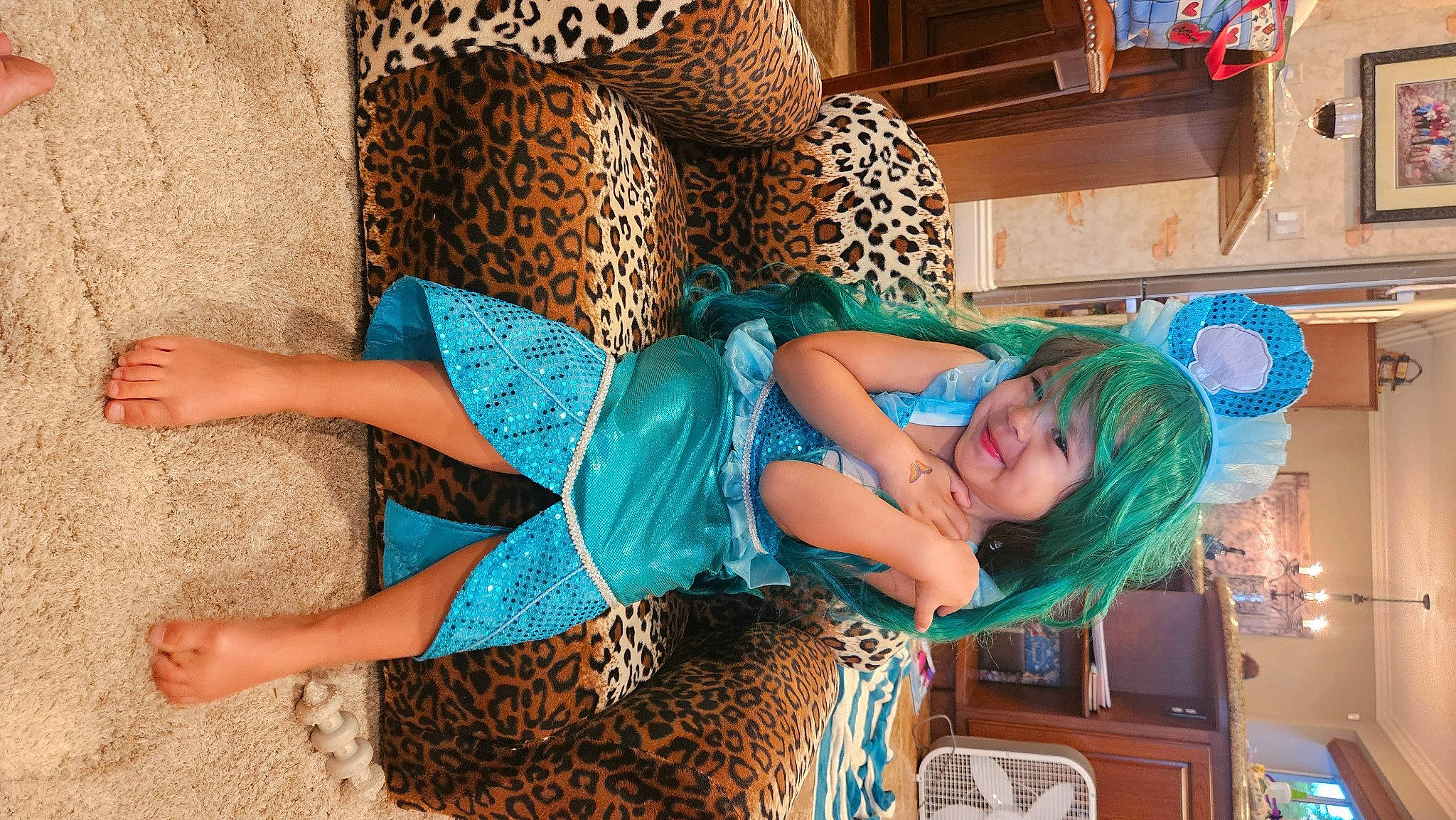 Olivia joined the competition — help win amazing prizes! aqua, azure, blue, dress, electric_blue, fashion_accessory, fashion_design, foot, fun, happy, headwear, human_body, human_leg, joint, leg, leisure, long_hair, pattern, person, sitting